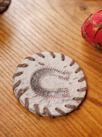 Underlägg i koskinn (2 st.)